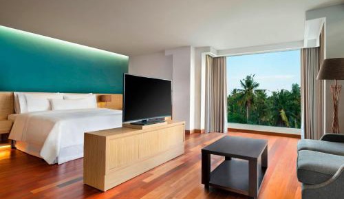 Punyan Suite Room, 1 Bedroom Suite, 1 King, Garden view, Balcony with Free Mini Bar, Daily Shuttle to Monkey Forest, Daily Yoga, Free Bike to borrow,  Free Family Activity and 24 Hour access to Motion Fitness Center